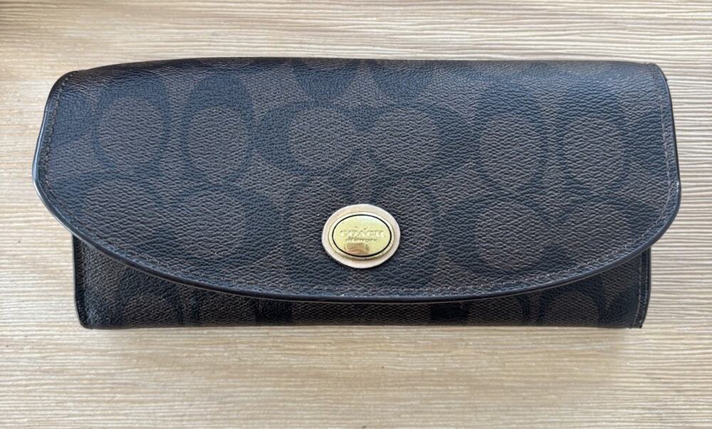 COACH PEYTON SIGNATURE WALLET BROWN AND GOLD WITH PEN MARK